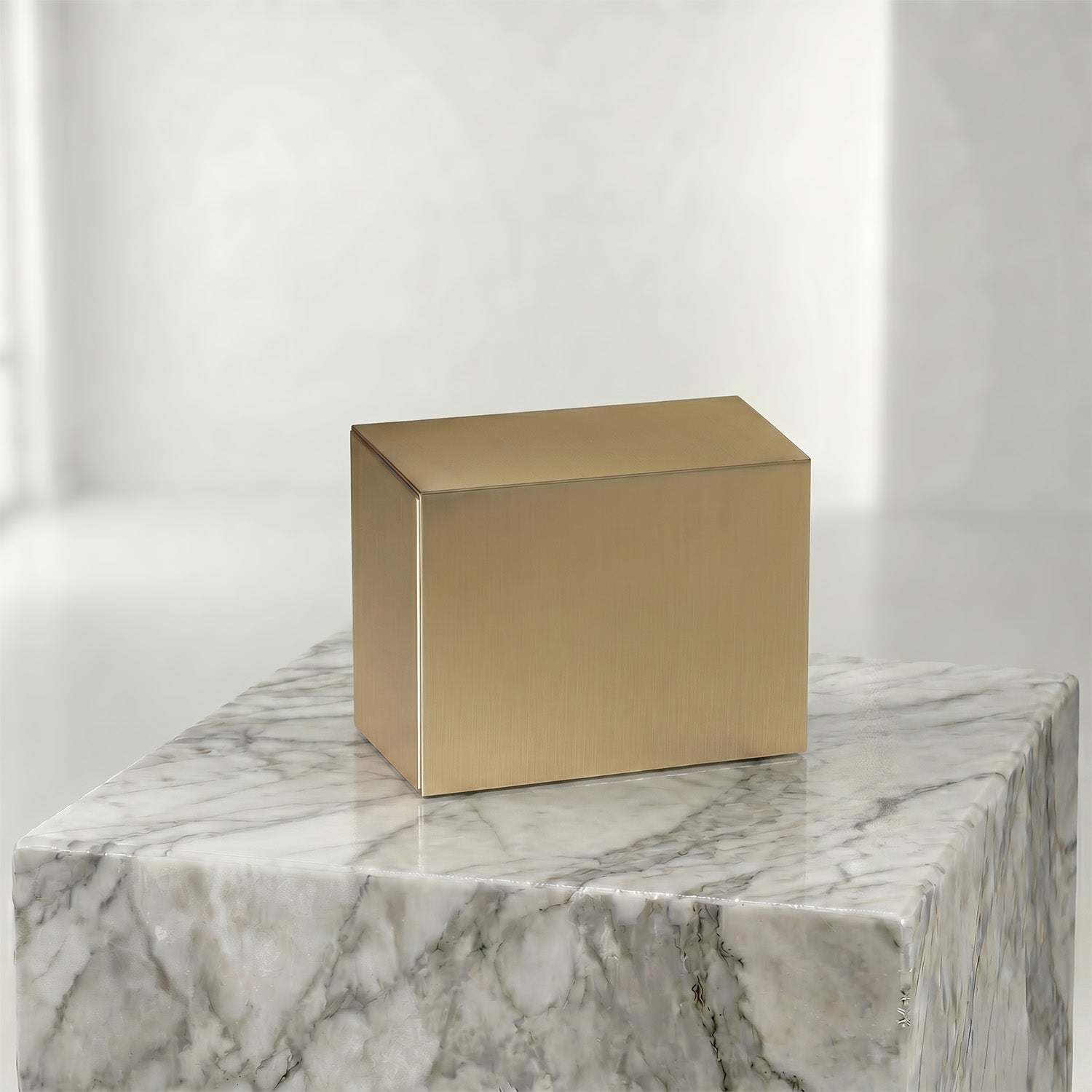 Bronze urn insert on a marble surface with a white background