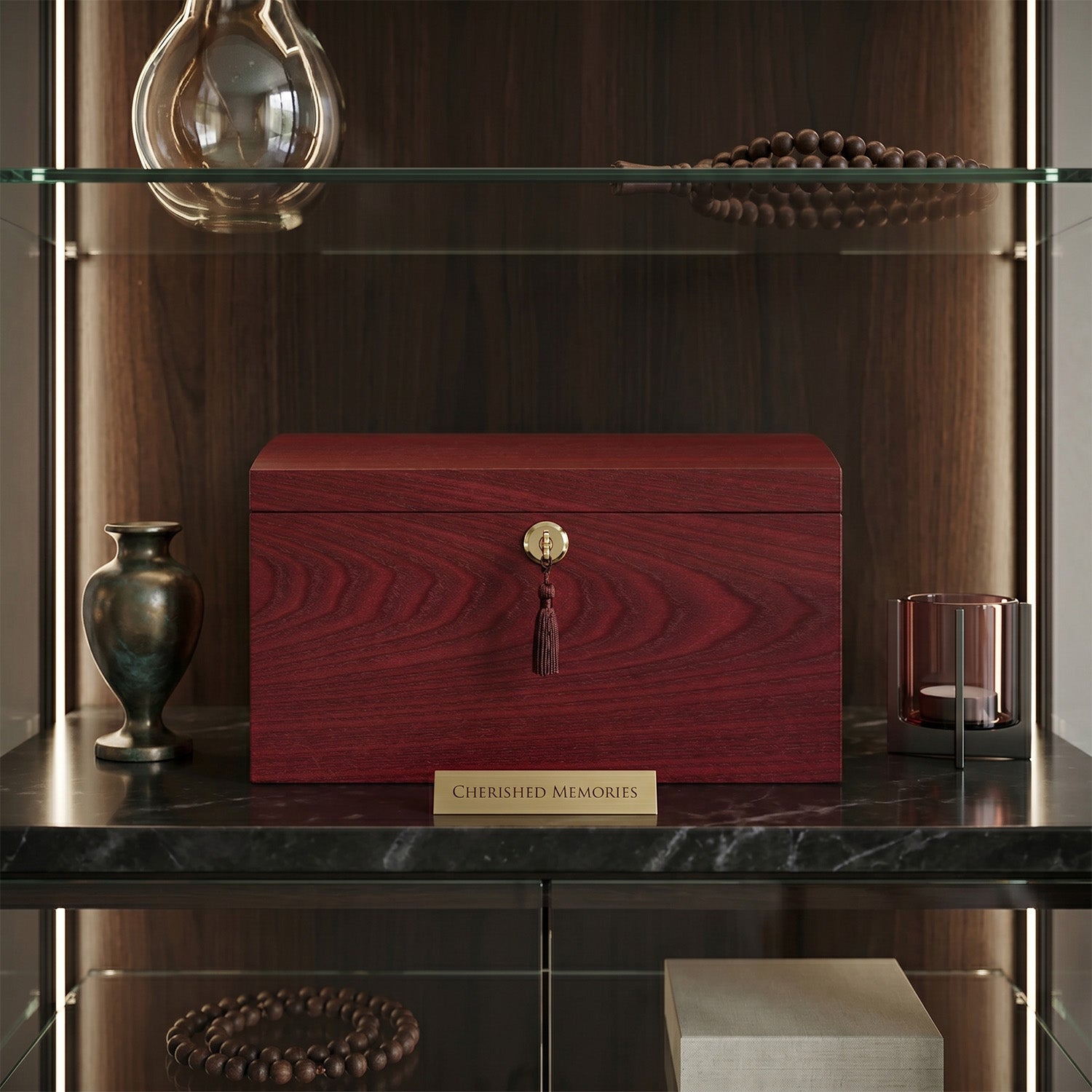 rosewood urn with a gold key
on a dark marble shelf.