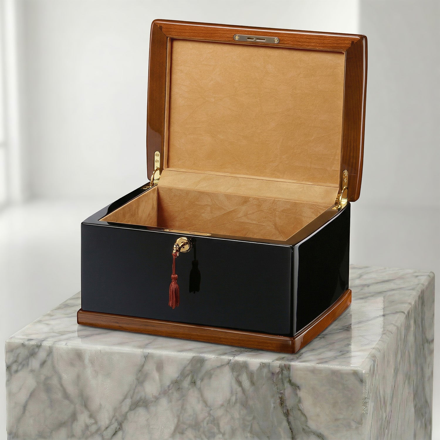 Wooden urn box with a black base and brown lid on a marble surface