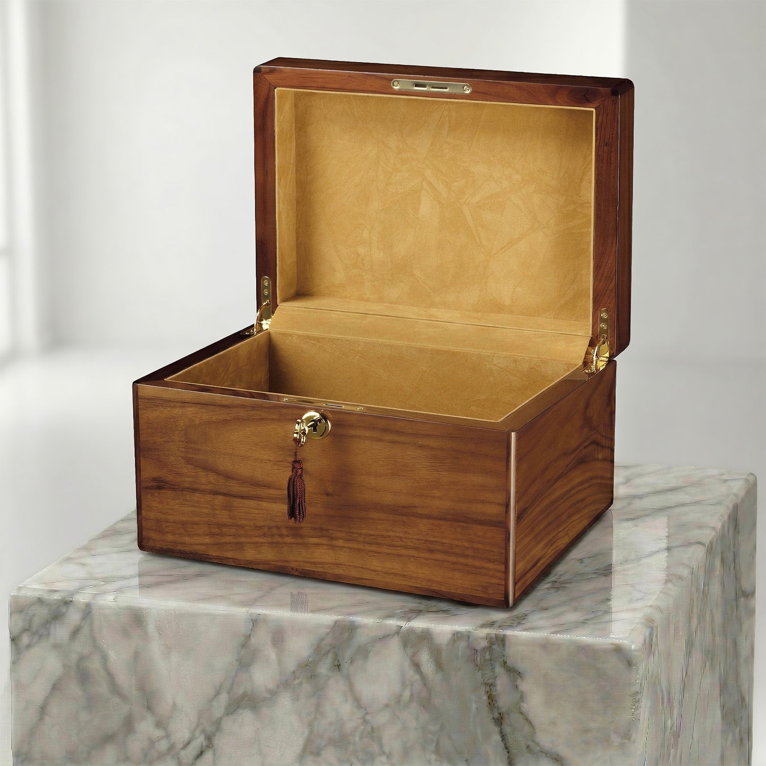 Wooden urn box with gold interior on a marble surface