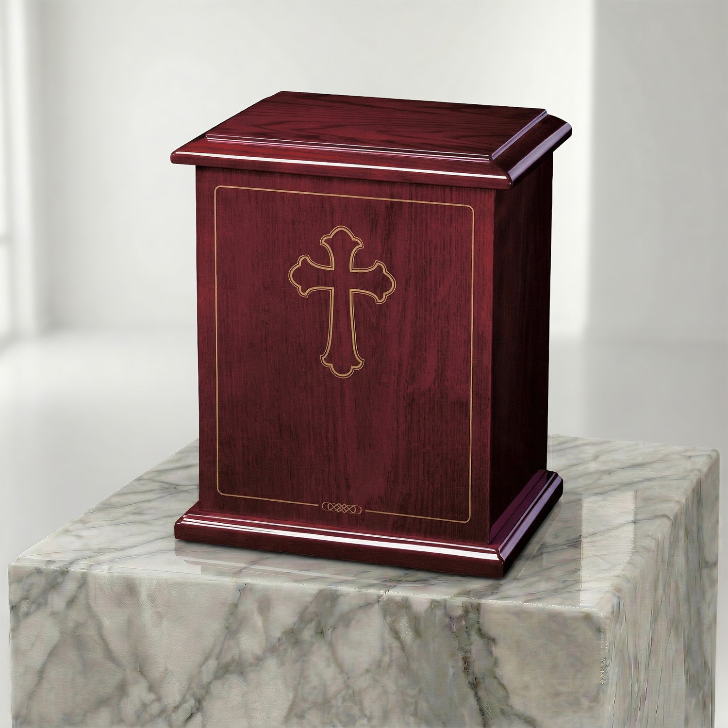 Wooden urn with a cross design on a marble surface
