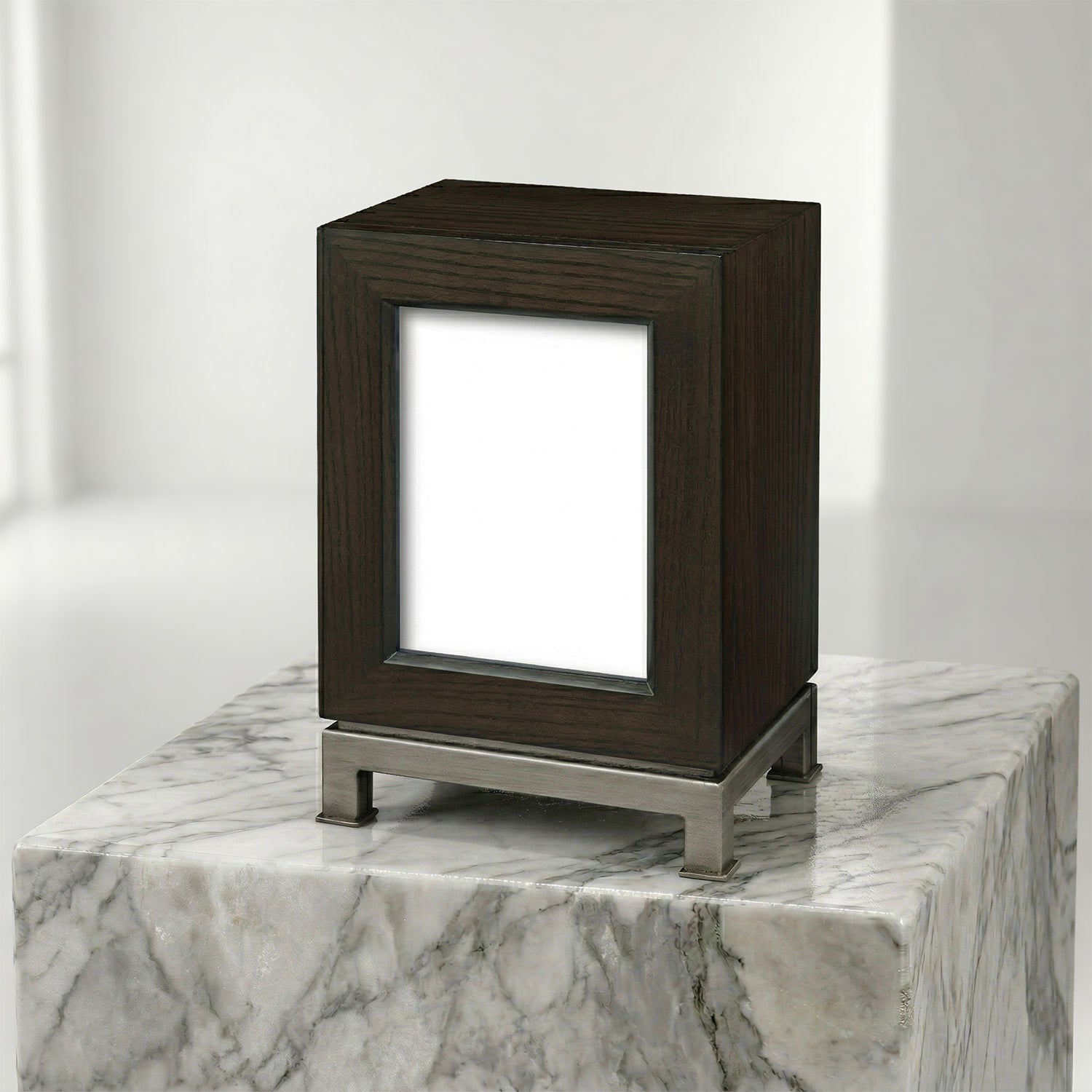 Dark wooden portrait urn on a marble surface with a white background