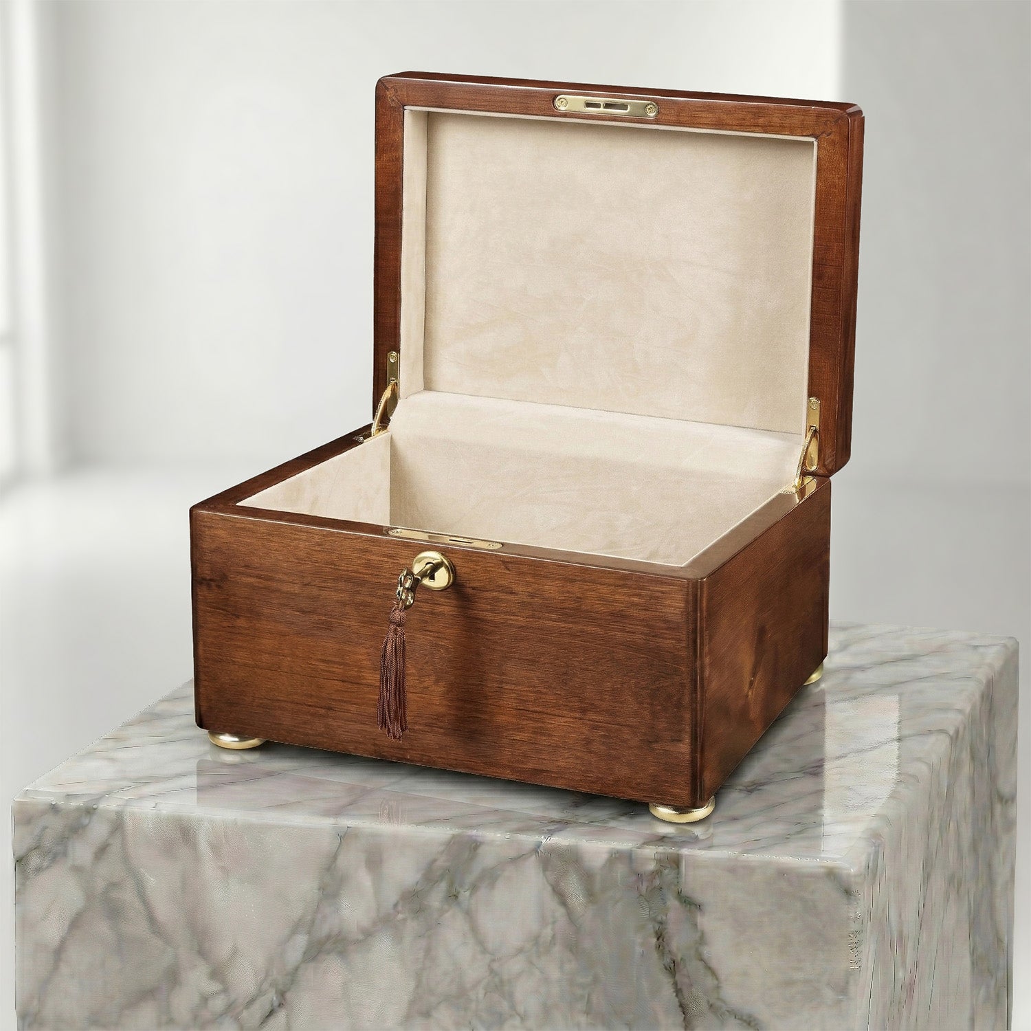 Wooden urn box with beige interior on a marble surface