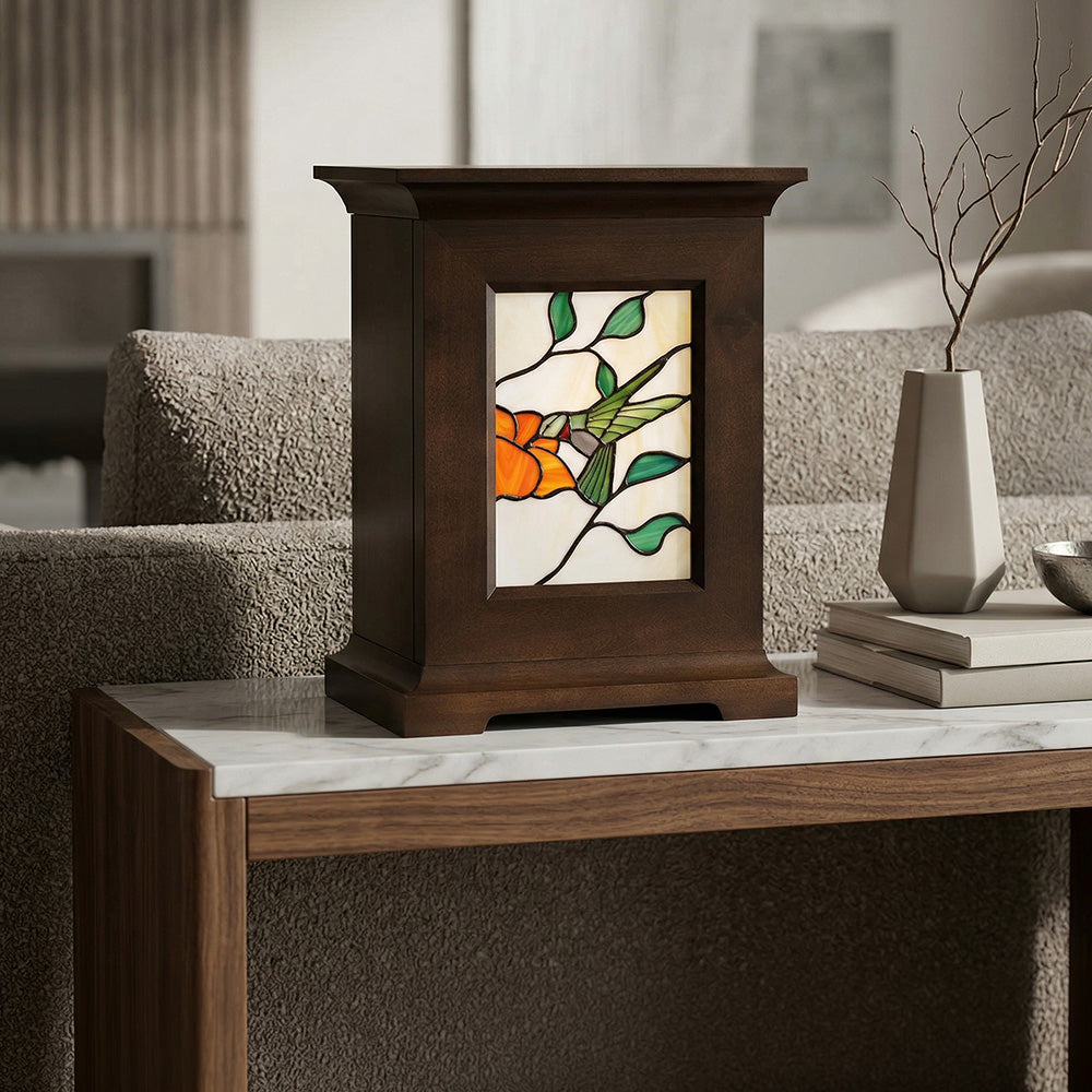 Decorative lamp urn with stained glass design on a marble surface