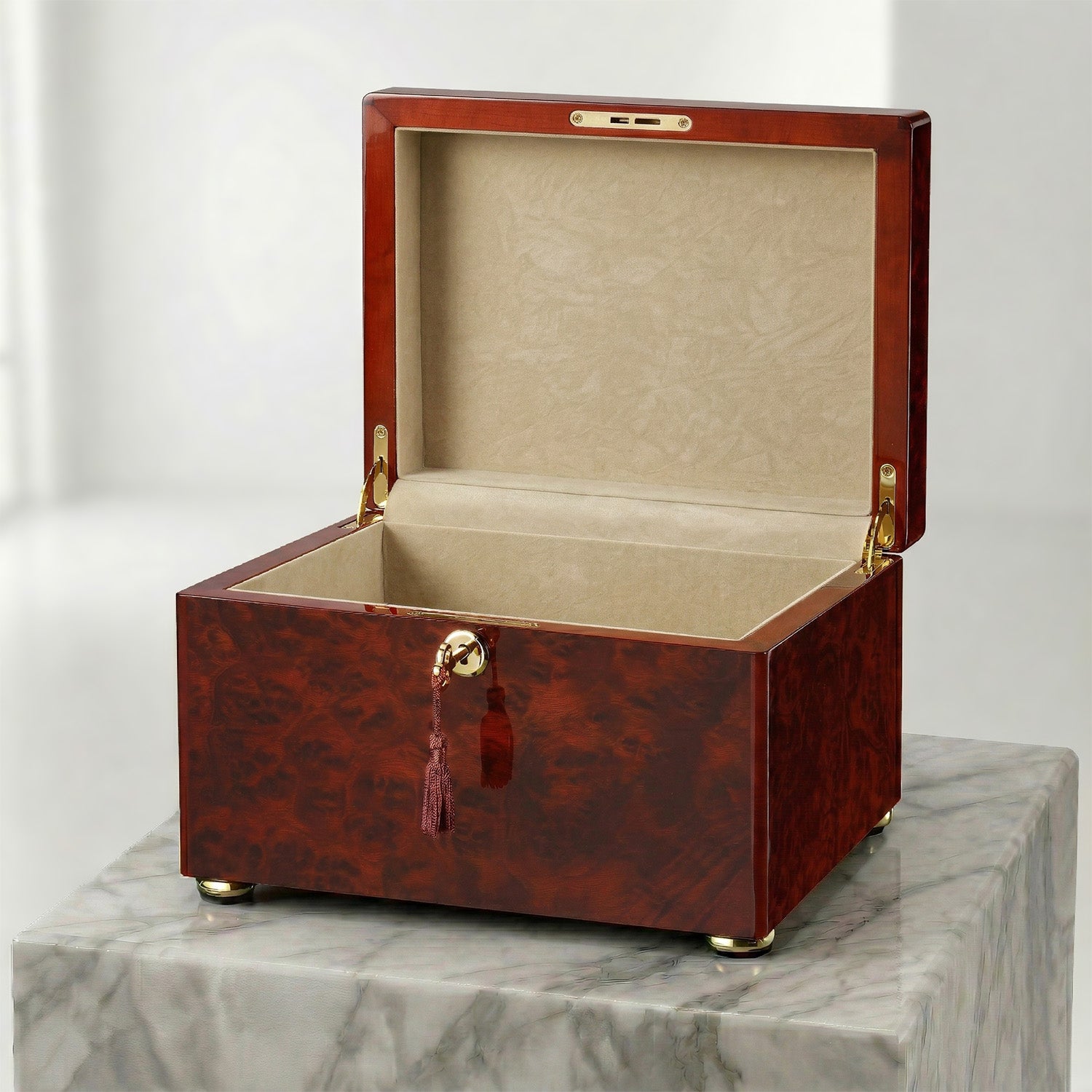 Wooden box urn with a key on a marble surface