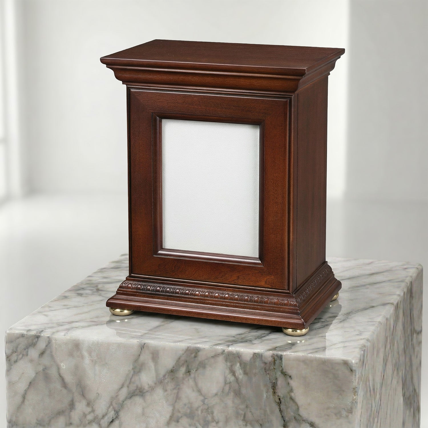 Wooden portrait urn on a marble surface with a white background