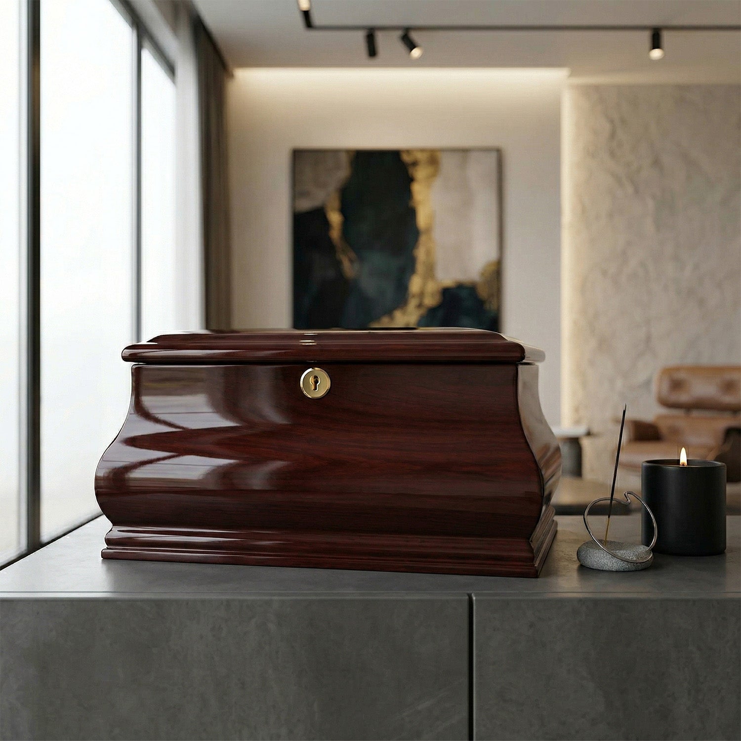 Wooden urn on a table with a candle and abstract painting in the background