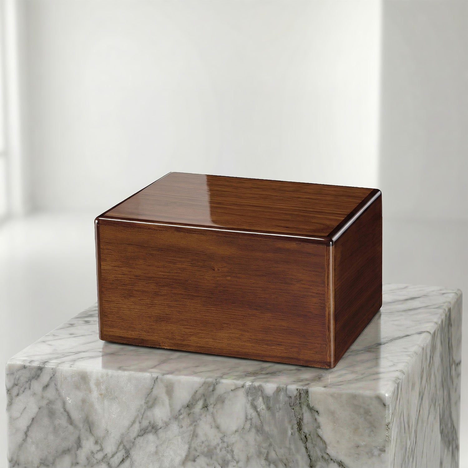 Wooden box urn on a marble surface with a white background