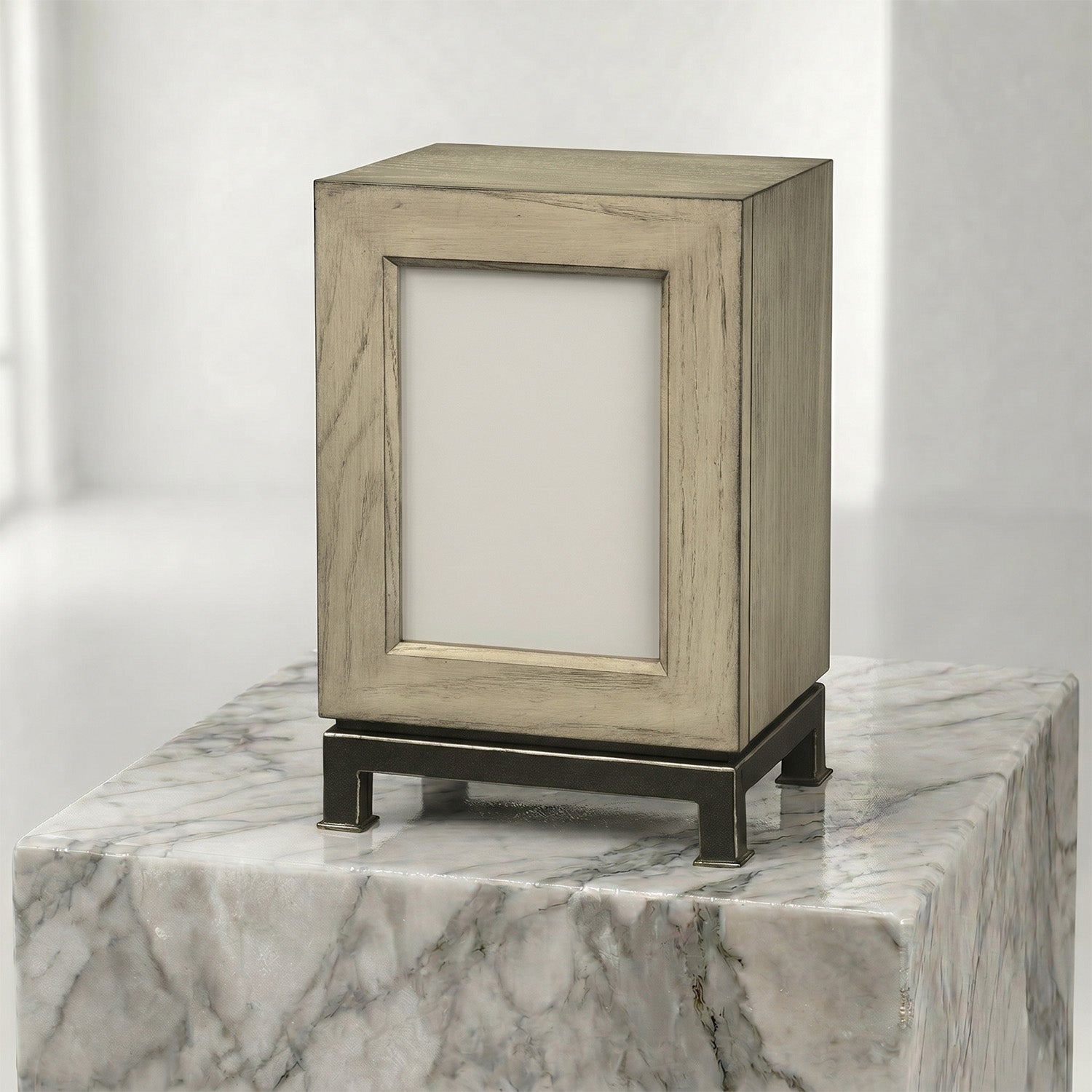 Wooden photo urn on a marble surface with a white background