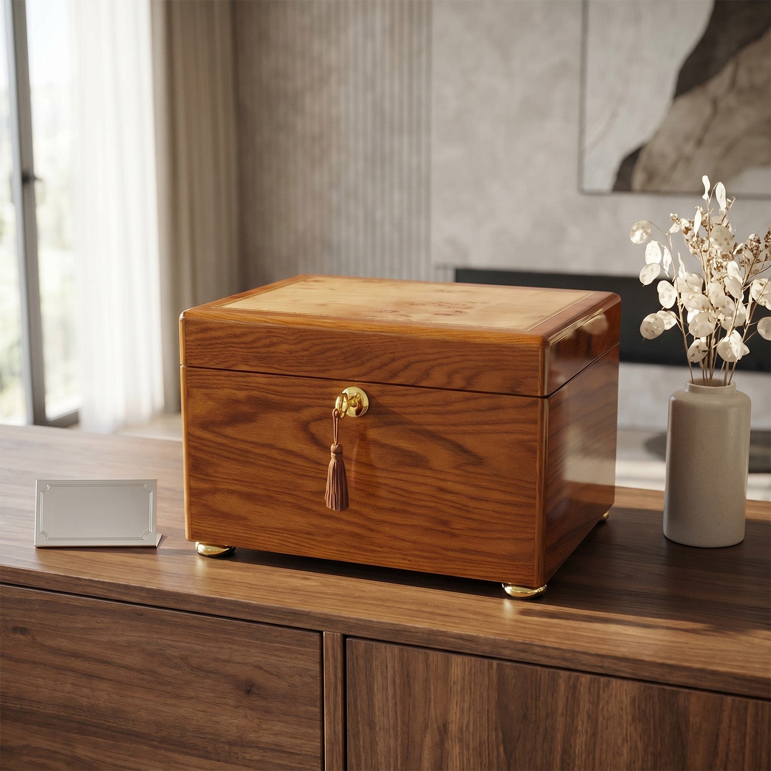 Wooden urn box with a decorative handle on a wooden surface.