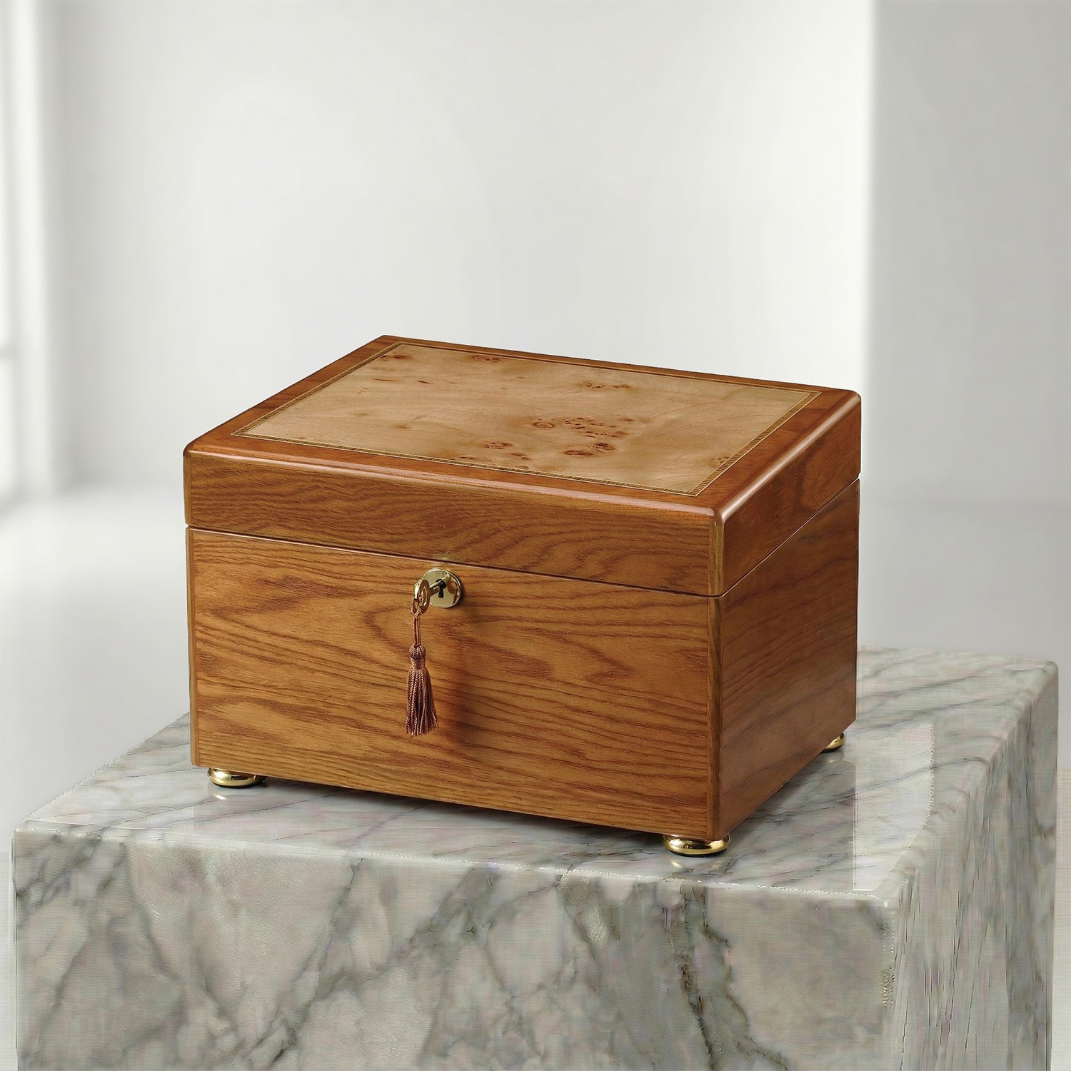 Wooden oak urn box on a marble surface
